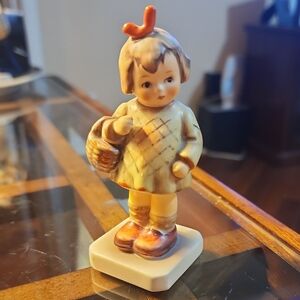 Adorable Ceramic Child Figurine with Basket